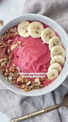 a bowl filled with fruit and nuts on top of a table