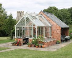 a small brick house with a glass roof