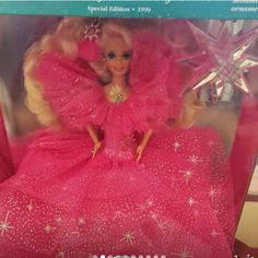 a barbie doll in a pink dress with snowflakes