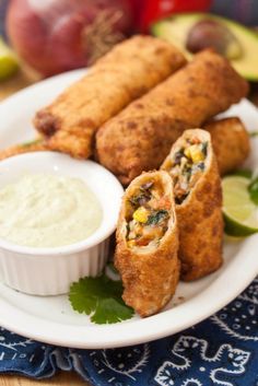 some food is sitting on a plate and ready to be eaten with dipping sauces