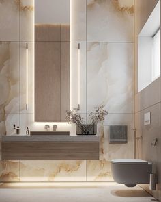 a modern bathroom with marble walls and floor