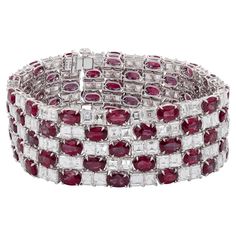 Sophia D. bracelet set in platinum that features a 39.49 carats of rubies and 33.17 carats of diamonds. Sophia D has been known world-wide for over 40 years because of its rich history of design and quality craftsmanship. From art deco to antique reproduction, these timeless pieces, when merged with modern manufacturing techniques, create a perfect harmony between old and new Diamond Ruby Bracelet, Platinum Bracelet, Ruby Bracelet, Perfect Harmony, Ruby Diamond, Art Deco Design, Classic Art, Over 40, Old And New