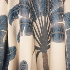 a curtain with blue and white leaves on it