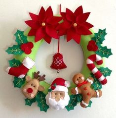 a christmas wreath with santa claus and reindeers