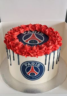 a paris saint - germain cake with red flowers on top