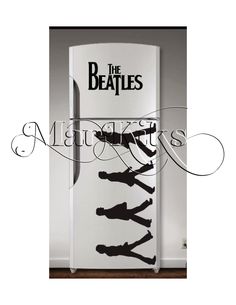 a refrigerator with the beatles on it