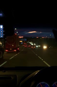 the dashboard of a car on a highway at night