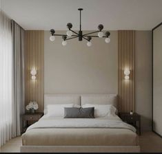 a bedroom with a large bed and two lamps hanging from the ceiling