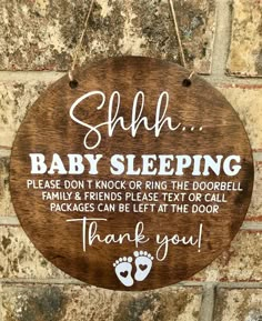 a wooden sign that says, shh baby sleeping please don't knock or ring the door