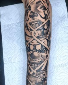 a man's arm with tattoos on it and an image of a face in the middle