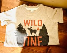 Excited to share this item from my #etsy shop: Wild One T Shirt, Kids tee, unisex clothing Wild One Moose Tee Shirt, First Birthday Wild One with Moose & Forest #white #gray #streetwear #wildonefirstbirth #wildonemoose #personalizedgifts #matchingtshirts #shirtsforfun #tshirt Wild One T Shirt, First Birthday Wild One, Birthday Wild One, Matching Tshirts, Personalized Socks, Types Of Gifts, Custom Socks, Funny Socks, Wild One