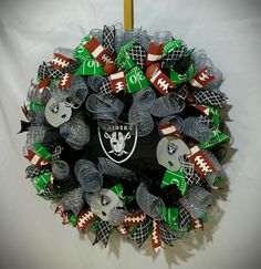 a wreath made out of footballs and other items