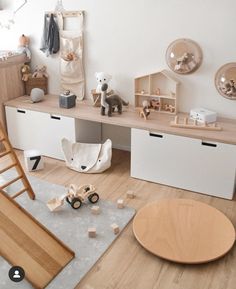 a child's room with toys and furniture on the floor