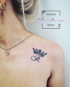 a woman with a crown tattoo on her chest