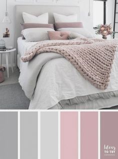 a bedroom with pink and grey colors in the walls, white bedding, gray carpet,