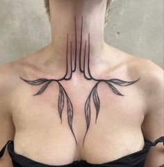 a woman's chest with two leaves on it and the top part of her neck