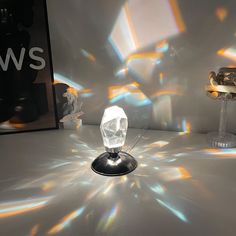 an object is shown on the table in front of a wall with light coming through it