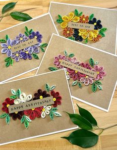 four greeting cards with flowers on them and the words happy anniversary written in large letters