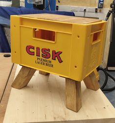 a yellow box sitting on top of a wooden table