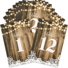 PRICES MAY VARY. Table Number Sign Set: we will provide you with 12 pieces of rustic table numbers, printed with numbers 1-12, which can meet the needs of most banquets, mark your table and make it convenient for guests to find their own position Reliable and Reusable: our wedding paper table numbers are made of quality 300 g coated paper, not easy to break or fade, which can be applied with various brackets as table decorations and table signs, and thick cardboard makes them reliable and reusab Rustic Wedding Reception Table Decor, Country Wedding Table Numbers, Wedding Seating Chart Table, Wood Lights, Wedding Table Seating Chart, Rustic Wedding Decor Diy, Wood Table Numbers, Wedding Guest Table, Rustic Table Numbers