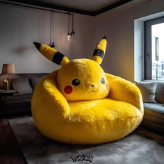 a large yellow pokemon bean bag chair in a living room