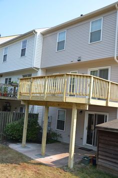 an apartment complex with two balconies and a deck