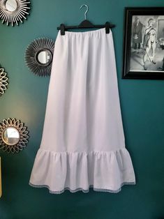 Long White Victorian Style Petticoat, With Lace Edge Frill & Elasticated Waist Size: SMALL Length: 39 Inches Size Guide: Small - Waist 26 - 30 Inches Medium - Waist 30 - 34 Inches Large - 34 - 38 Inches THESE HAVE BEEN DESIGNED AND MADE IN-HOUSE. OTHER COLOURS AND SIZES ARE AVAILABLE, AND BULK ORDERS ARE ALWAYS WELCOME. Free Shipping UK Only White Long Lined Skirt Petticoat, White Cotton Petticoat Skirt, White Lace Trim Tiered Petticoat, Victorian Theatre, White Long Gathered Petticoat, Victorian White Cotton Petticoat, White Victorian, Lace Edging, Small Waist