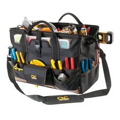 a tool bag filled with lots of tools and gadgets on it's side