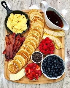 breakfast platter with bacon, pancakes, blueberries and fruit