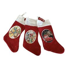 three christmas stockings with disney characters on them