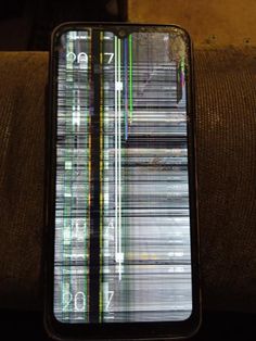 an image of a cell phone with lines on the screen and numbers on the back