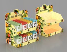 an open cardboard box with different types of food in it on a gray surface,