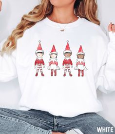 Our Christmas Elf graphic sweatshirt features a vintage inspired watercolor elfs design. You'll love the comfortable material of the Gildan sweatshirt fabric. It ensures a soft and comfortable feel that will keep you feeling good all day long. This unisex trendy and aesthetic graphic sweatshirt and hoodie will have you standing out from the crowd. Christmas Elf Sweatshirt, Merry Christmas Crewneck For Women, Oversized Cute Christmas Hoodie, Watercolor Elves Shirt, Christmas Elf Sweater SIZE UP f Elf Sweatshirt, Elf Sweater, Elf Shirt, Retro Graphic Tees, Christmas Crewneck, Christmas Hoodie, Cute Graphic Tees, Holiday Sparkle, Sweatshirt Fabric