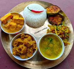 a metal plate topped with different types of food