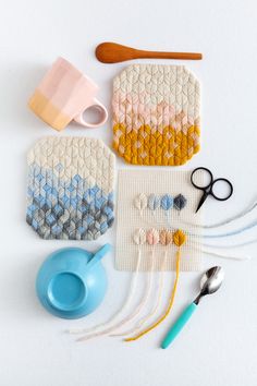 sewing supplies laid out on a white surface with scissors, yarn and other items to sew