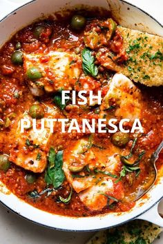 fish in tomato sauce with green olives and parmesan bread on the side