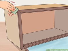 an empty bookcase with the door open and someone's hand on top of it