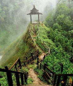 stairs leading up to a gazebo at the top of a hill