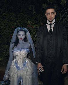 a man and woman dressed up as corpse brides in costume for the day of the dead