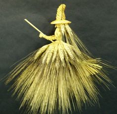 an image of a straw hat hanging from a hook