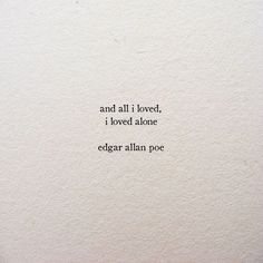 an old typewriter with the words and all i loved, i loved atone edgar allen poe