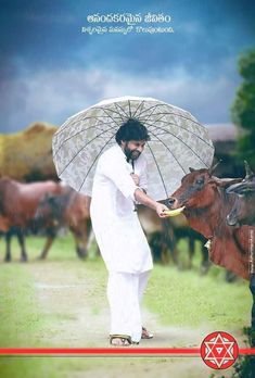 a man standing next to a cow holding an umbrella