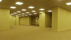 an empty room with several lights on the ceiling and no one in the room to be seen