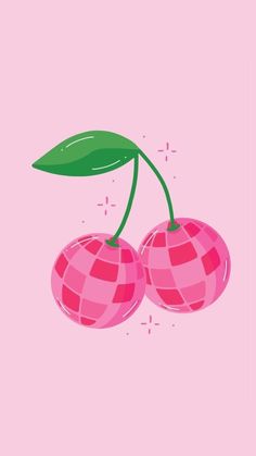 two cherries with green leaves on pink background