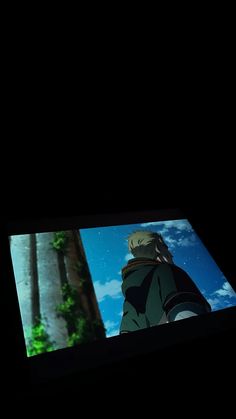 an anime scene is shown in the dark