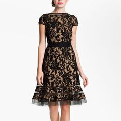 Tadashi Shoji Kennedy Embroidered Black Floral Lace Sz 10 This Is A Gorgeous Dress That Has Small Details To Set It Apart. It Is A High Neck Black Layered Lace Look For Nice Visual Interest. The Lace Has A Nude Under-Layer To Really Give Depth. Cap Sleeves.The Skirt Is A Fit And Flare Style But My Favorite Part Of The Dress Is Actually At The Hemline. It Has Bands Of Tulle Trim That Give A Nice Stacked Almost Floating Look. It Is So Cute On. The Black Color Is Eye-Catching! Lovely Designer Dress! No Belt, Color: Black And Nude Condition: Excellent Used Condition, No Flaws To Note Size: 10 Pit To Pit 18" Length 37" Elegant Floral Embroidery Lace Dress, Elegant Floral Embroidery Lace Dress For Formal Occasions, Elegant Dresses With Resham Embroidery And Short Sleeves, Formal Embroidered Lace Dress, Elegant Beige Dresses With Resham Embroidery, Formal Black Dress With Lace Work, Formal Silk Dress With Lace Work, Elegant Lace Dress With Resham Embroidery, Elegant Fitted Lace Dress With Floral Embroidery