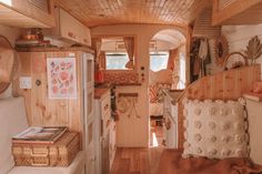 the interior of a tiny home with wood paneling