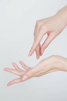 two hands reaching out towards each other