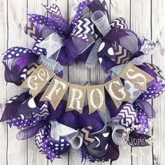 a purple and silver wreath with the word groos on it