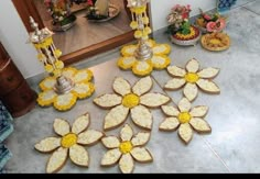 there are many decorated cookies sitting on the floor next to each other in front of a mirror